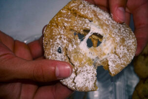 hand pulling apart a gooey s'mores cookie